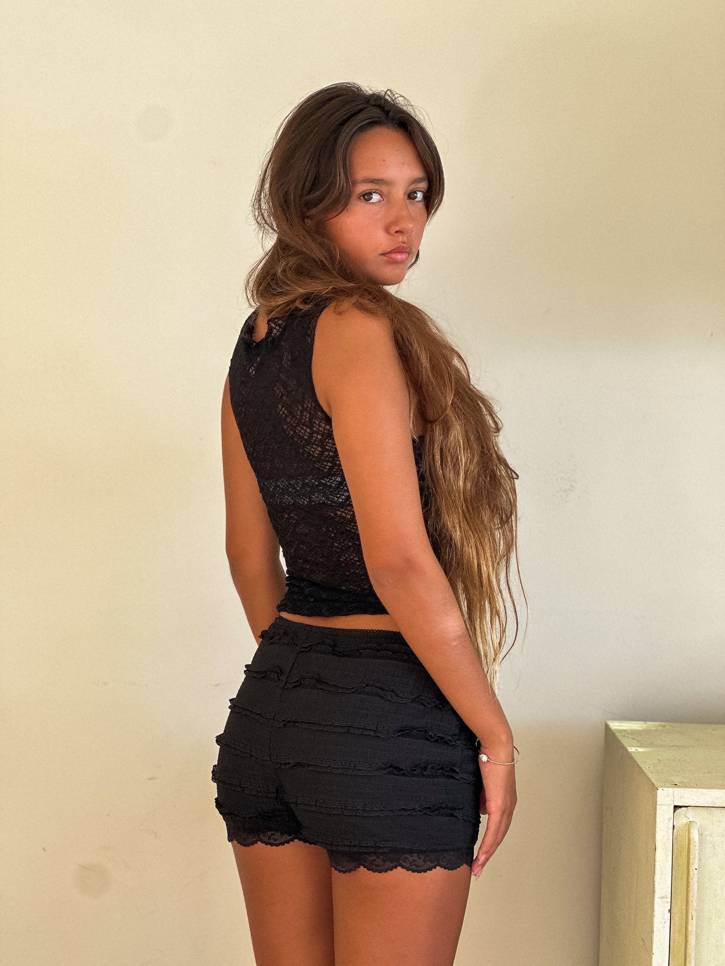 black sheer sleeveless top